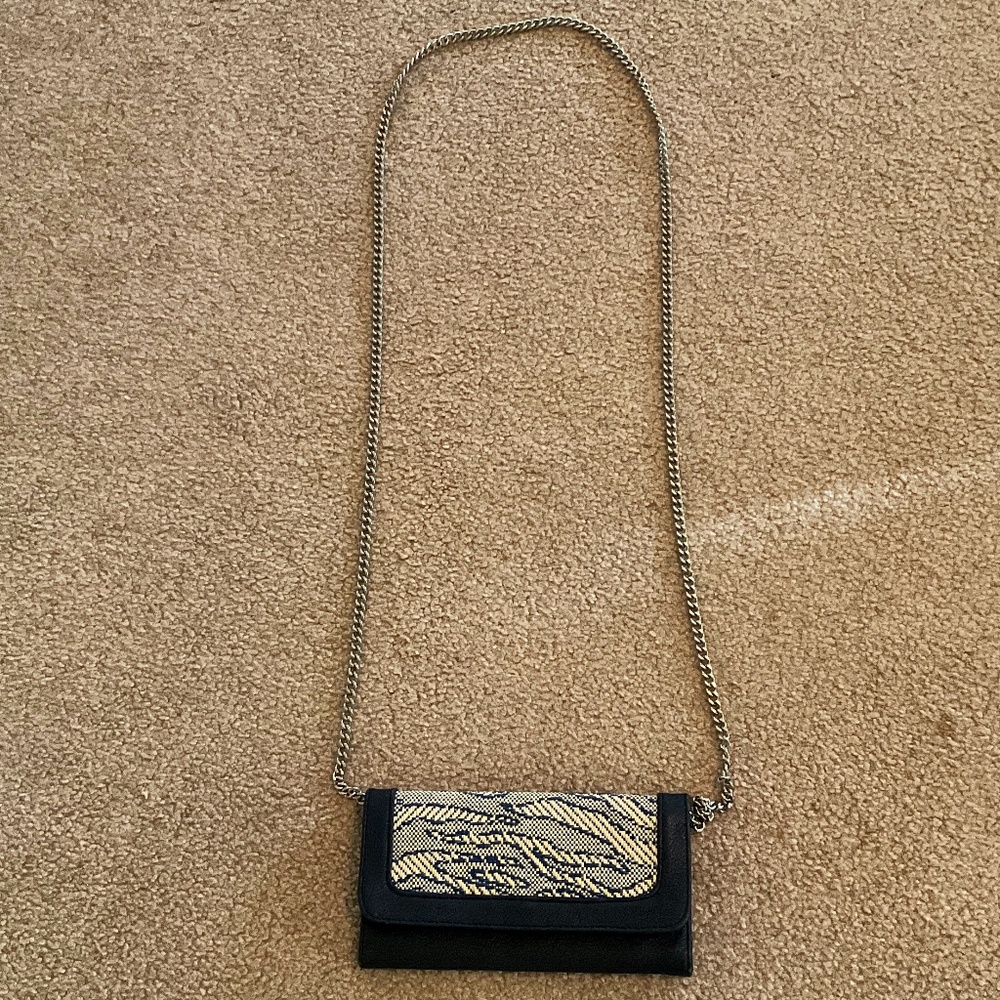 navy blue handbag with silver chain, 6 card slots, and photo ID slot